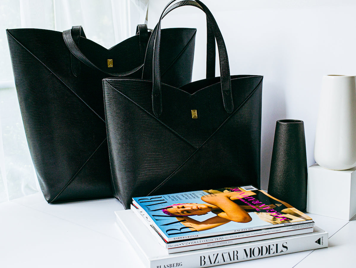 Two black lizard print vegan leather handbag totes.