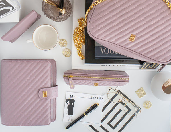 Luxury vegan leather quilted mauve handbag with pencil case and planner.